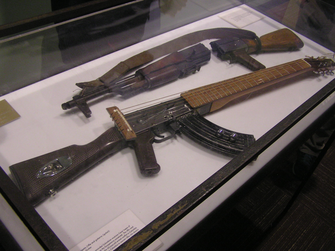UN display - rifle converted to guitar - from Colombia